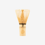 Traditional bamboo matcha whisk (chasen) with Dakys logo, designed for perfect ceremonial matcha preparation.